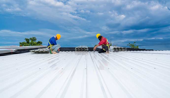 Professional team installing commercial roof