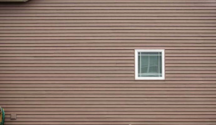 Close-up view of newly installed siding on a wall