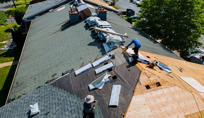 Professional team performing commercial roof repair