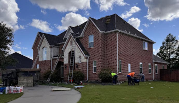 Righteous Construction & Restoration team repairing a roof