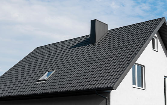 A house with newly installed roofing, showcasing completed installation.