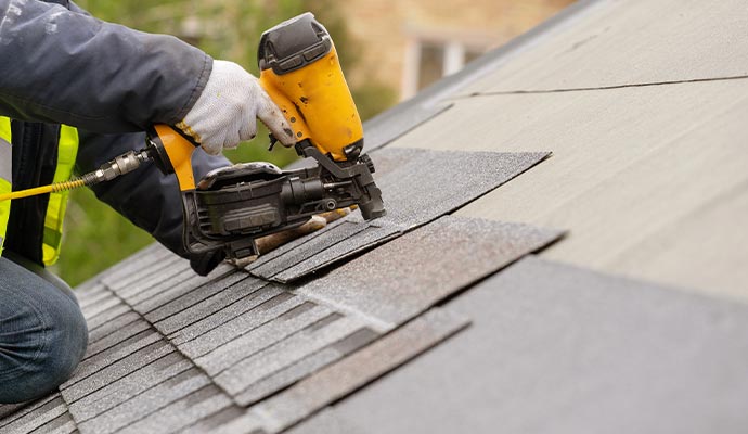 Professional installing a new roof