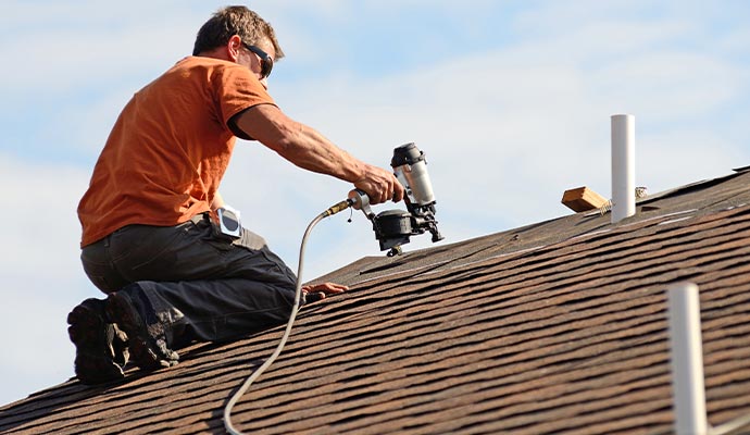 Professional installing a new roof