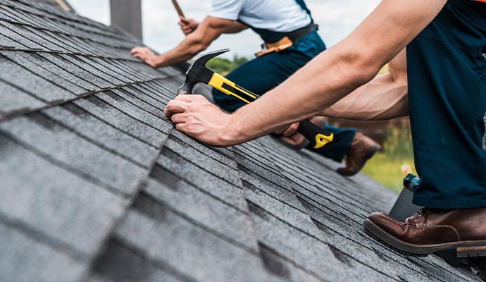 Person repairing the roof with equipment