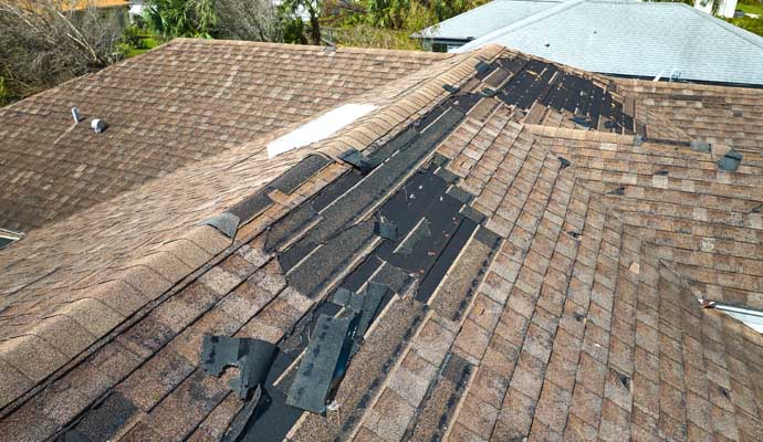 Roof with damaged shingles