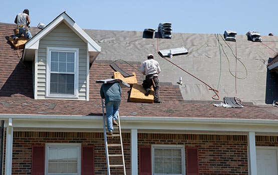 Professional roofing service being performed on a home.