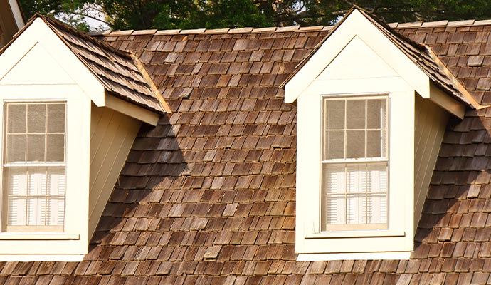 Installed a wooden shingle roof on the house