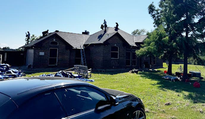 Person repairing the roof after storm