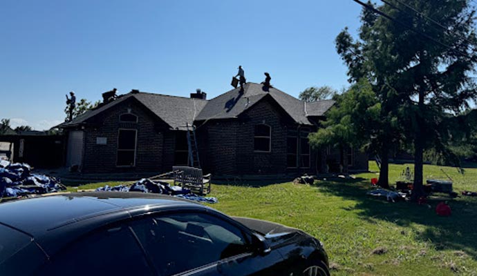 Righteous Construction & Restoration team repairing a damaged roof