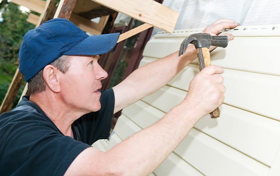 Technician fixing a sliding roof shingle