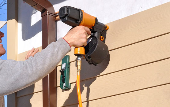 professionals installing siding