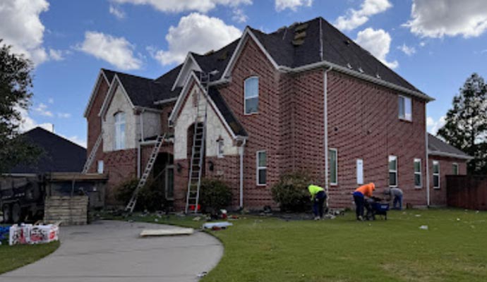 A damaged house being repaired by a professional