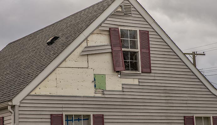 Storm damaged house siding